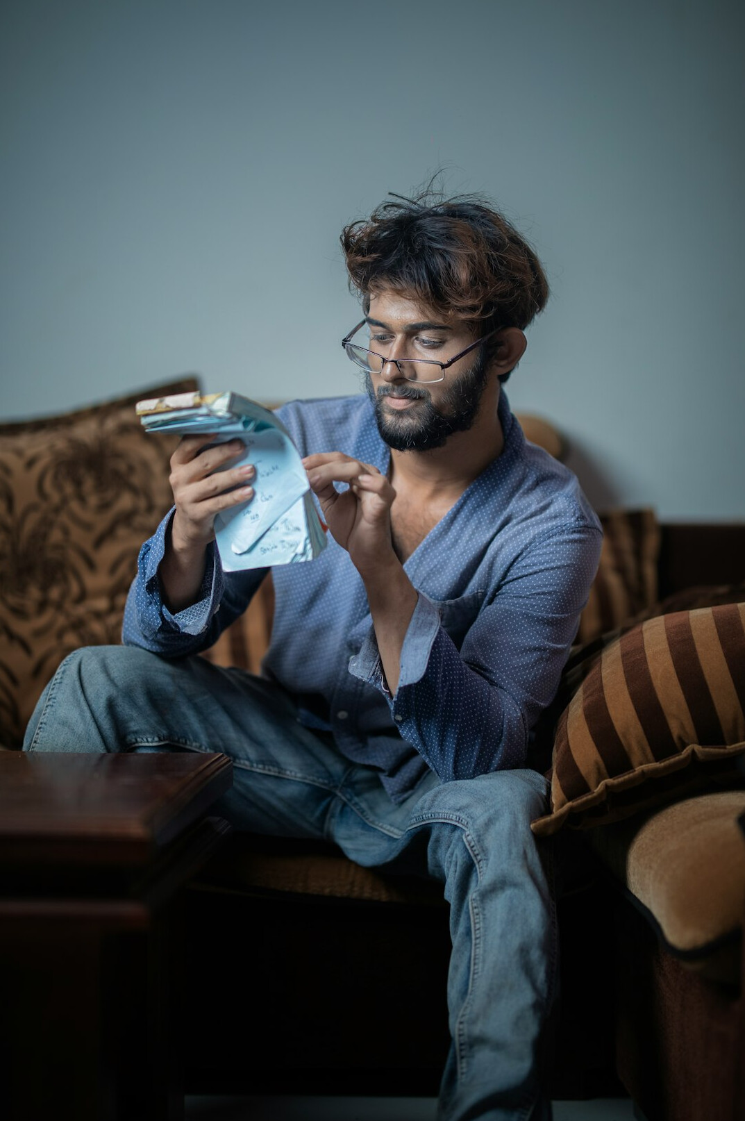 person counting coins at home