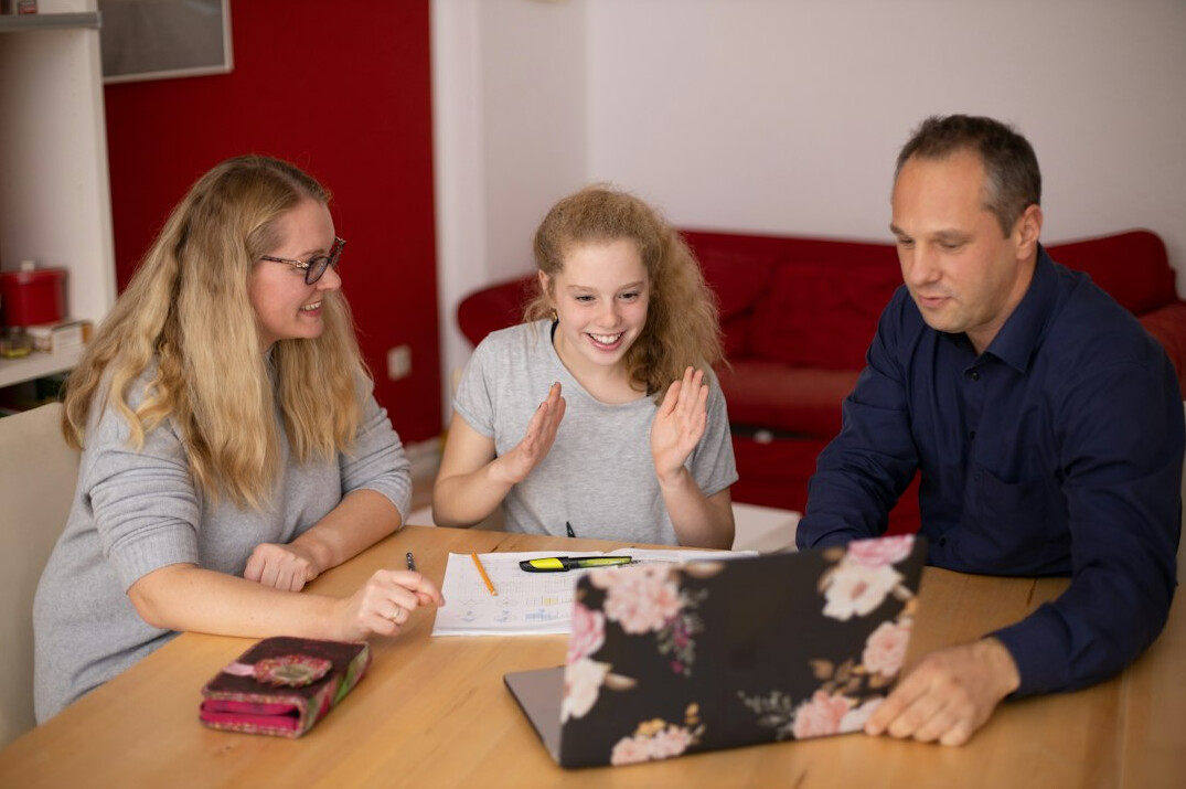 family discussing finances at table